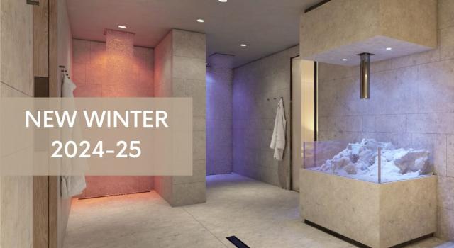 Spa moderna con docce colorate e neve artificiale, inverno 2024-25.