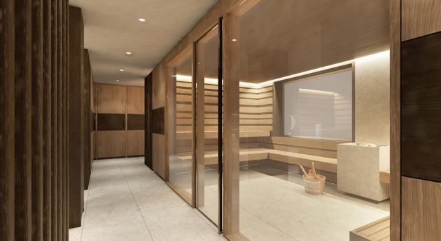 Corridoio moderno con sauna in legno e pareti in vetro.